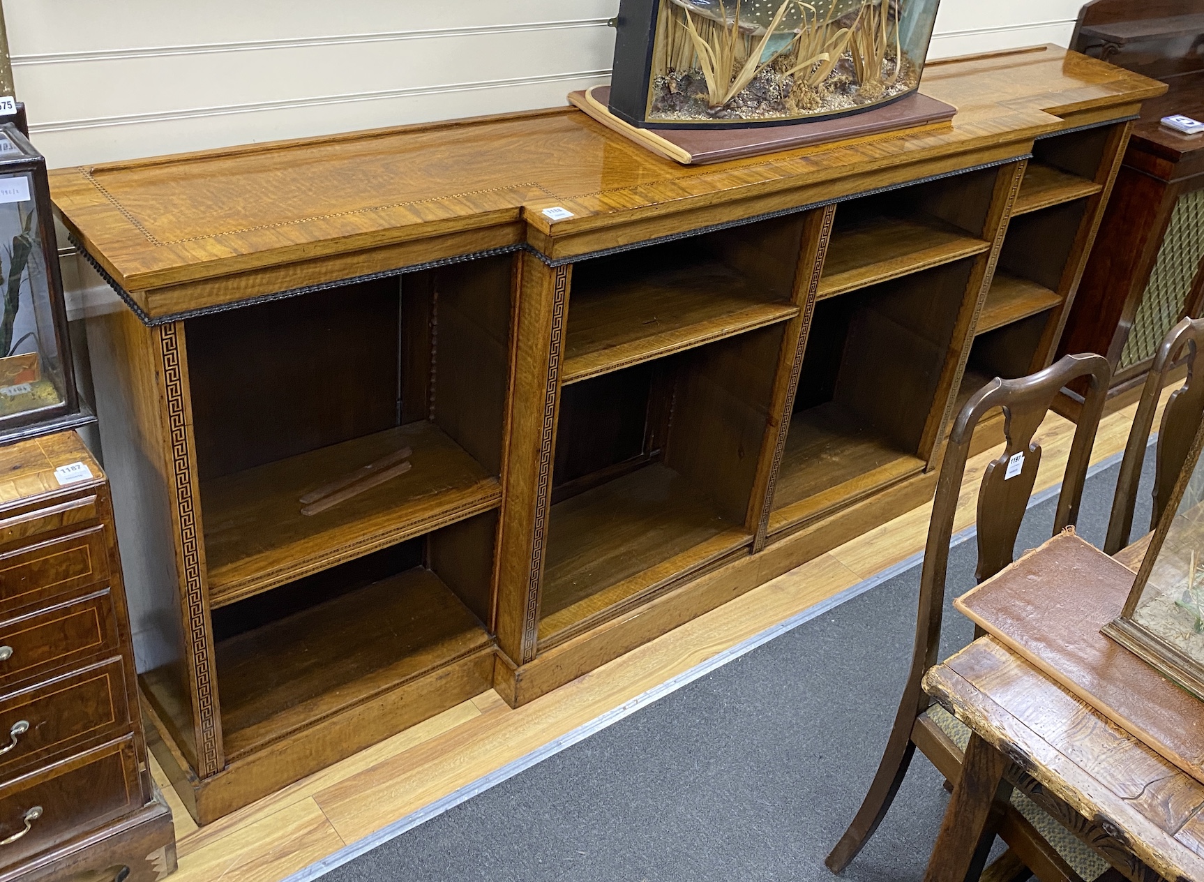 A Regency style banded inlaid walnut breakfront dwarf bookcase, width 266cm, depth 45cm, height 109cm